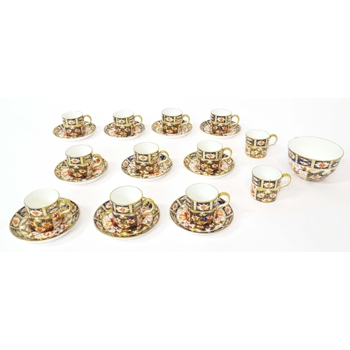 157 - A quantity of Royal Crown Derby coffee cups, saucers, and a sugar bowl decorated in the Imari palett... 