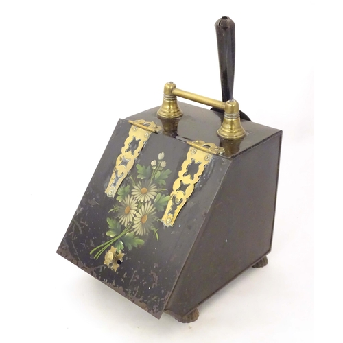 2091 - A late 19thC tin coal scuttle, with brass handle and hinges, in black painted finish, the lid decora... 