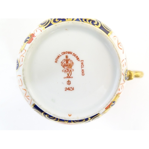 217 - A quantity of assorted ceramics to include a Royal Crown Derby coffee cup and saucer decorated in th... 