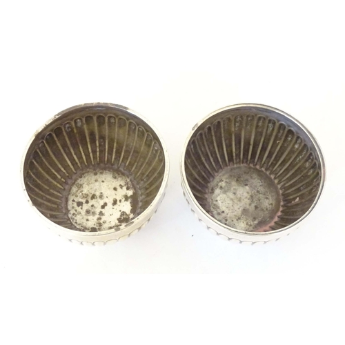 463 - A pair of Victorian silver salts with fluted decoration hallmarked Chester 1900, maker Stokes & Irel... 