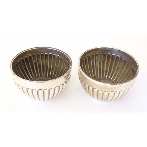 463 - A pair of Victorian silver salts with fluted decoration hallmarked Chester 1900, maker Stokes & Irel... 