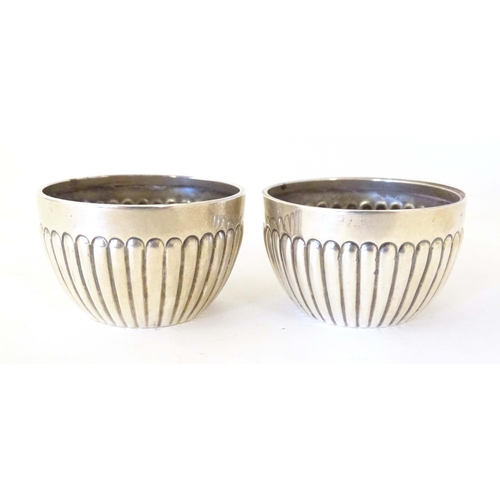 463 - A pair of Victorian silver salts with fluted decoration hallmarked Chester 1900, maker Stokes & Irel... 