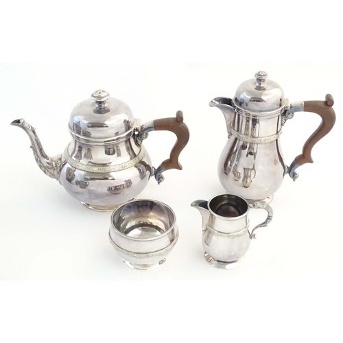 554 - A three piece silver plate tea set comprising teapot, sugar bowl and cream jug, the teapot marked un... 