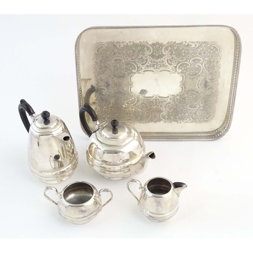 555 - An Art Deco four piece silver plate by Walker & Hall, together with an associated silver plate tray.... 