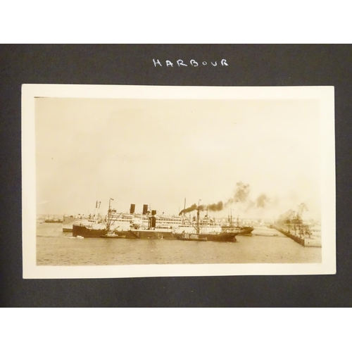 968 - An early 20thC travel photograph album to include Madeira harbour, figures and donkeys in Tangier, S... 