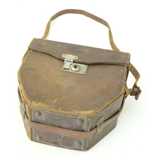 976A - An early to mid 20thC leather pannier case, together with an Ensign cinecamera case. Largest approx.... 