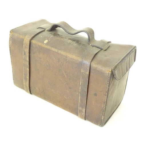 976A - An early to mid 20thC leather pannier case, together with an Ensign cinecamera case. Largest approx.... 