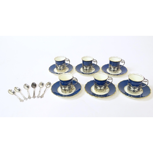 289 - A cased set of six Art Deco Coalport coffee / tisane cups and saucers with pierced silver holders fo... 