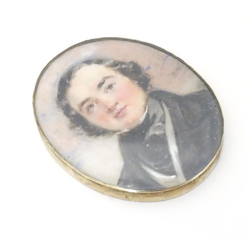 627 - A 19thC watercolour portrait miniature depicting a gentleman in a black jacket and cravat, within an... 