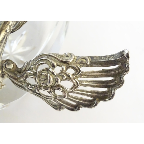 481 - A cut glass salt with silver mounts modelled as a swan. Approx. 2 3/4