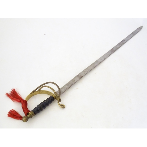 992 - Militaria: a 20thC ceremonial/prop/display sword, of steel and brass construction, 38 1/8