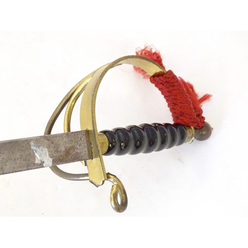 992 - Militaria: a 20thC ceremonial/prop/display sword, of steel and brass construction, 38 1/8