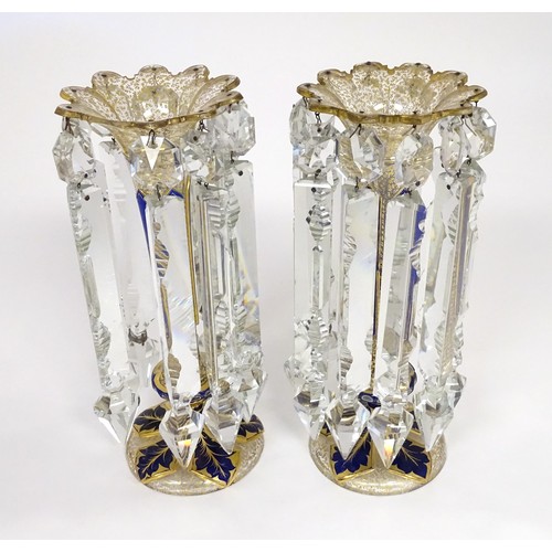 226 - A pair of Victorian glass table lustres with blue and gilt detail. Approx 12