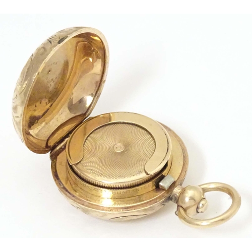 792 - A gilt metal sovereign case by A L Dennison Watch Case Company, titled to centre Made in England gol... 