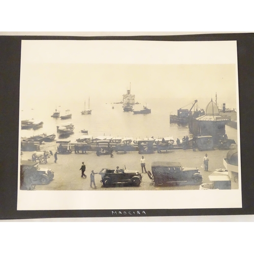 968 - An early 20thC travel photograph album to include Madeira harbour, figures and donkeys in Tangier, S... 