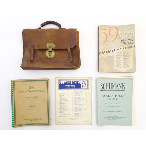 8 - A late 19th / early 20thC leather attache case containing sheet music to include Edward Grieg - Comp... 