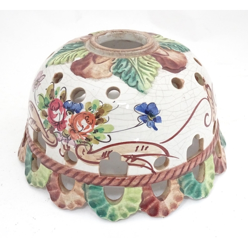 26 - A Continental ceramic lamp shade with floral and foliate decoration. Approx. 8