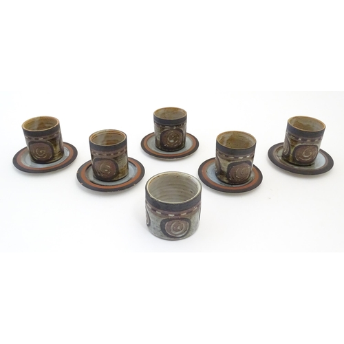 43 - Five Briglin studio pottery coffee cups and saucers, together with a sugar bowl. Cups approx. 3