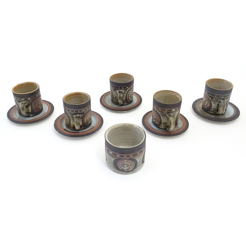 43 - Five Briglin studio pottery coffee cups and saucers, together with a sugar bowl. Cups approx. 3
