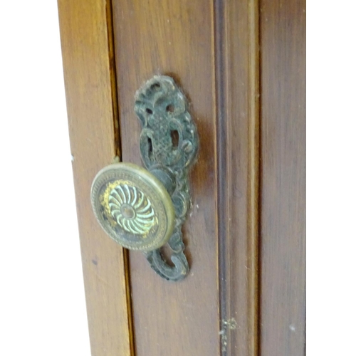 72 - A mahogany bedside / pot cupboard with drop flap top. Approx. 31 1/2