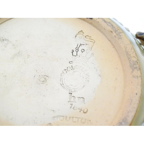 91 - A Royal Doulton stoneware teapot decorated with flowers and foliage. Marked under Doulton Slaters Pa... 