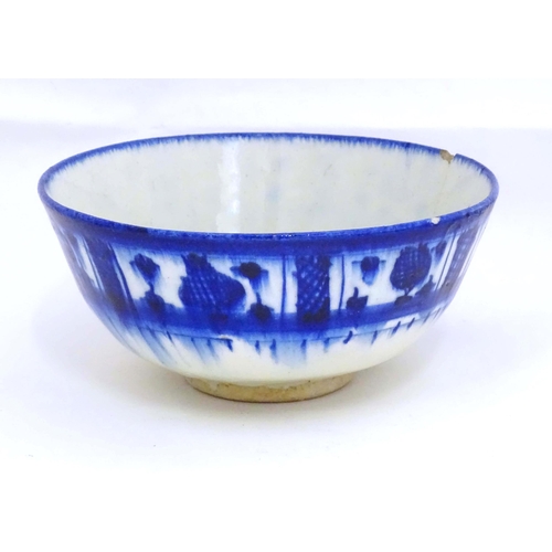 105 - A Continental blue and white bowl with banded decoration. Approx. 4