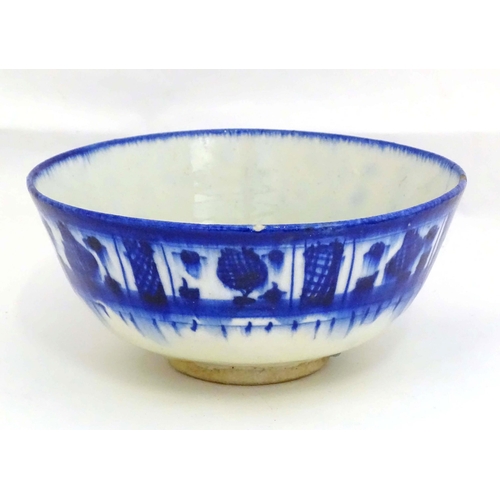 105 - A Continental blue and white bowl with banded decoration. Approx. 4