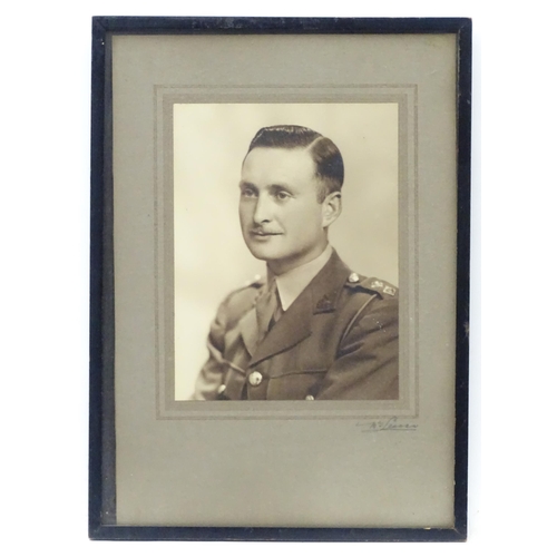 107 - Militaria: a studio portrait photograph of a Lieutenant of the British Army, c1930s, 8 1/8