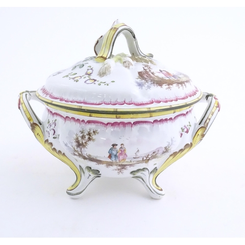 42 - A French lidded tureen with foliate formed handles and standing on four out swept feet, the lid with... 