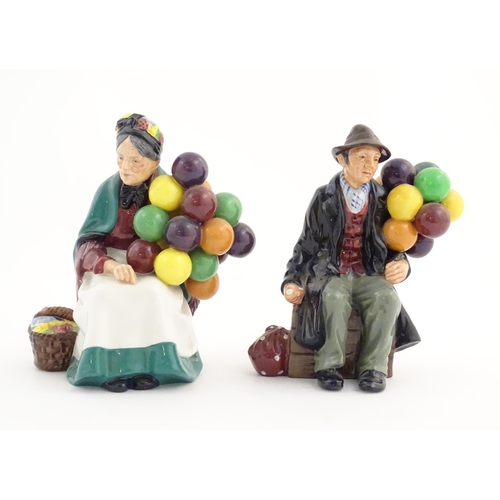 95 - Two Royal Doulton figures modelled as balloon sellers, HN1315 and HN1954. Marked under. Approx. 7 1/... 