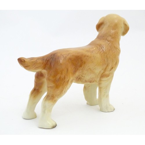 97 - A Beswick model of a Yellow Labrador, no. 2287. Together with a model of a Golden Retriever. Marked ... 