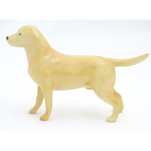 97 - A Beswick model of a Yellow Labrador, no. 2287. Together with a model of a Golden Retriever. Marked ... 