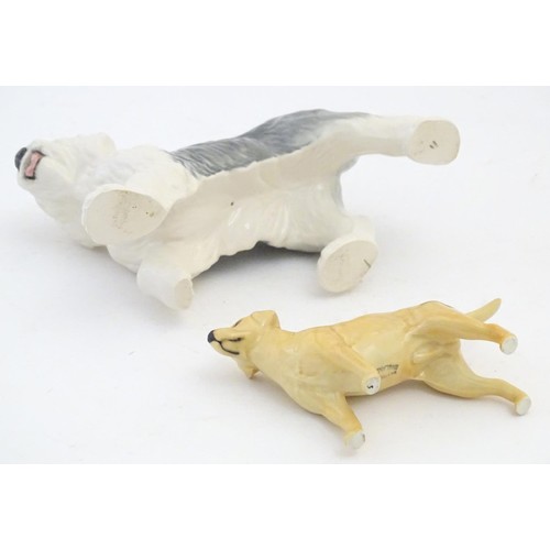 98 - Two Beswick models of dogs comprising a Yellow Labrador, no. 1548, and an Old English Sheepdog, no. ... 