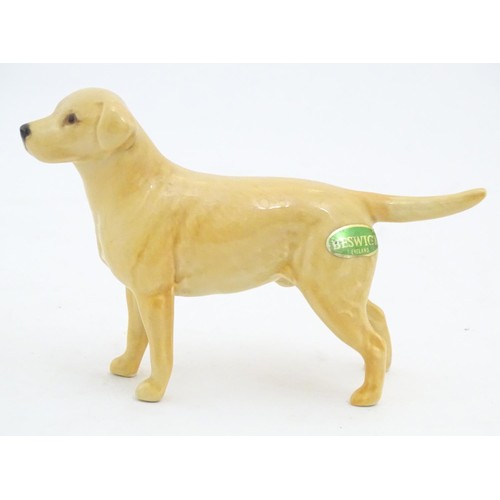 98 - Two Beswick models of dogs comprising a Yellow Labrador, no. 1548, and an Old English Sheepdog, no. ... 