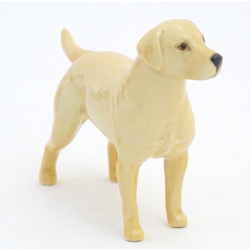 98 - Two Beswick models of dogs comprising a Yellow Labrador, no. 1548, and an Old English Sheepdog, no. ... 