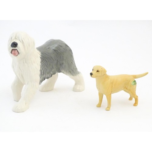 98 - Two Beswick models of dogs comprising a Yellow Labrador, no. 1548, and an Old English Sheepdog, no. ... 