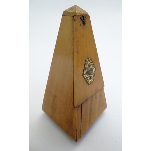 1059 - An early 20thC clockwork metronome, the pyramid case bearing brass plaque for 'Metronome Maelzel' an... 