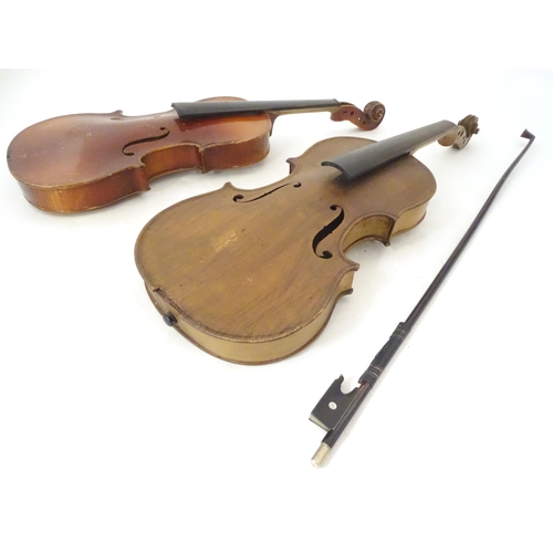 1060 - Musical Instruments: the major parts of two mid 20thC violins, each approx. 23 1/8