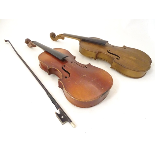 1060 - Musical Instruments: the major parts of two mid 20thC violins, each approx. 23 1/8