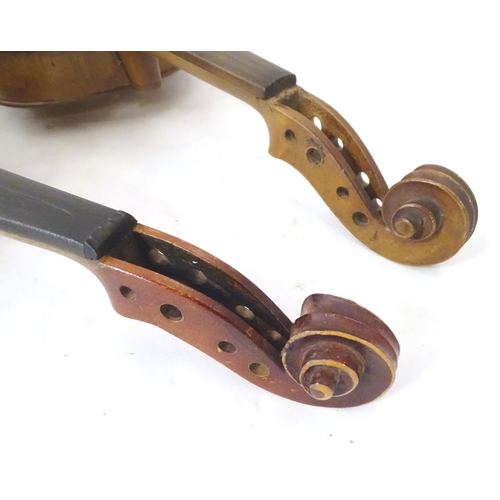 1060 - Musical Instruments: the major parts of two mid 20thC violins, each approx. 23 1/8