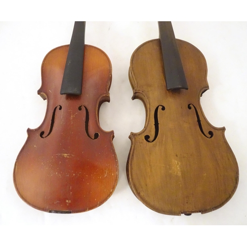 1060 - Musical Instruments: the major parts of two mid 20thC violins, each approx. 23 1/8