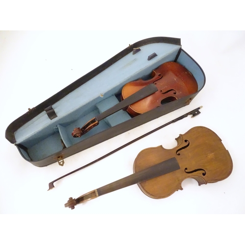 1060 - Musical Instruments: the major parts of two mid 20thC violins, each approx. 23 1/8