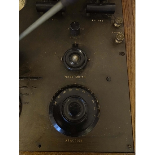 1064 - An AJS  'Type F' wireless receiver table-top valve radio, in a fitted oak case with BBC label, manuf... 
