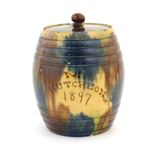 59 - A Scottish biscuit jar and cover of barrel form marked Mrs Hutcheon 1897, by Seaton Pottery. Approx.... 