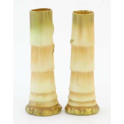 91 - A pair of Royal Worcester spill vases with relief bamboo detail. Marked under with 1049. Approx. 5