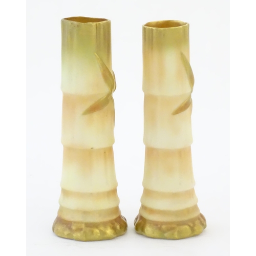 91 - A pair of Royal Worcester spill vases with relief bamboo detail. Marked under with 1049. Approx. 5