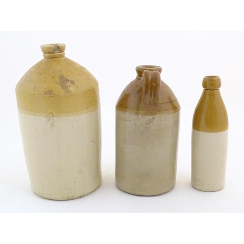 977 - A trio of stoneware flagons, comprising an early 20thC beer/spirits carrier with impressed mark: 796... 