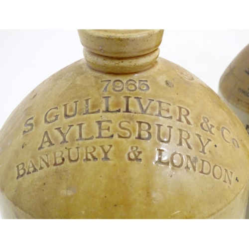 977 - A trio of stoneware flagons, comprising an early 20thC beer/spirits carrier with impressed mark: 796... 