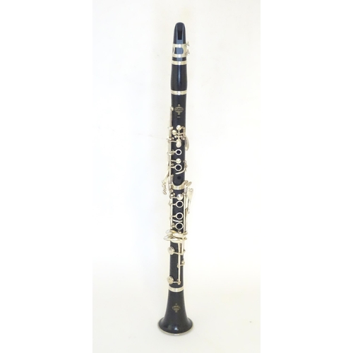 1062 - Musical Instrument : a late 20thC E11 clarinet by Buffet Crampon & Cie, Paris. Constructed from turn... 