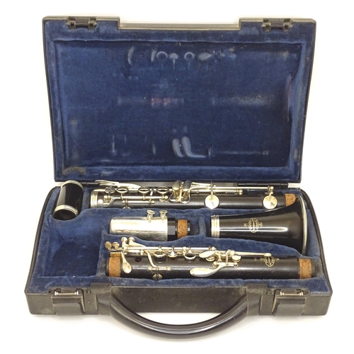 1062 - Musical Instrument : a late 20thC E11 clarinet by Buffet Crampon & Cie, Paris. Constructed from turn... 